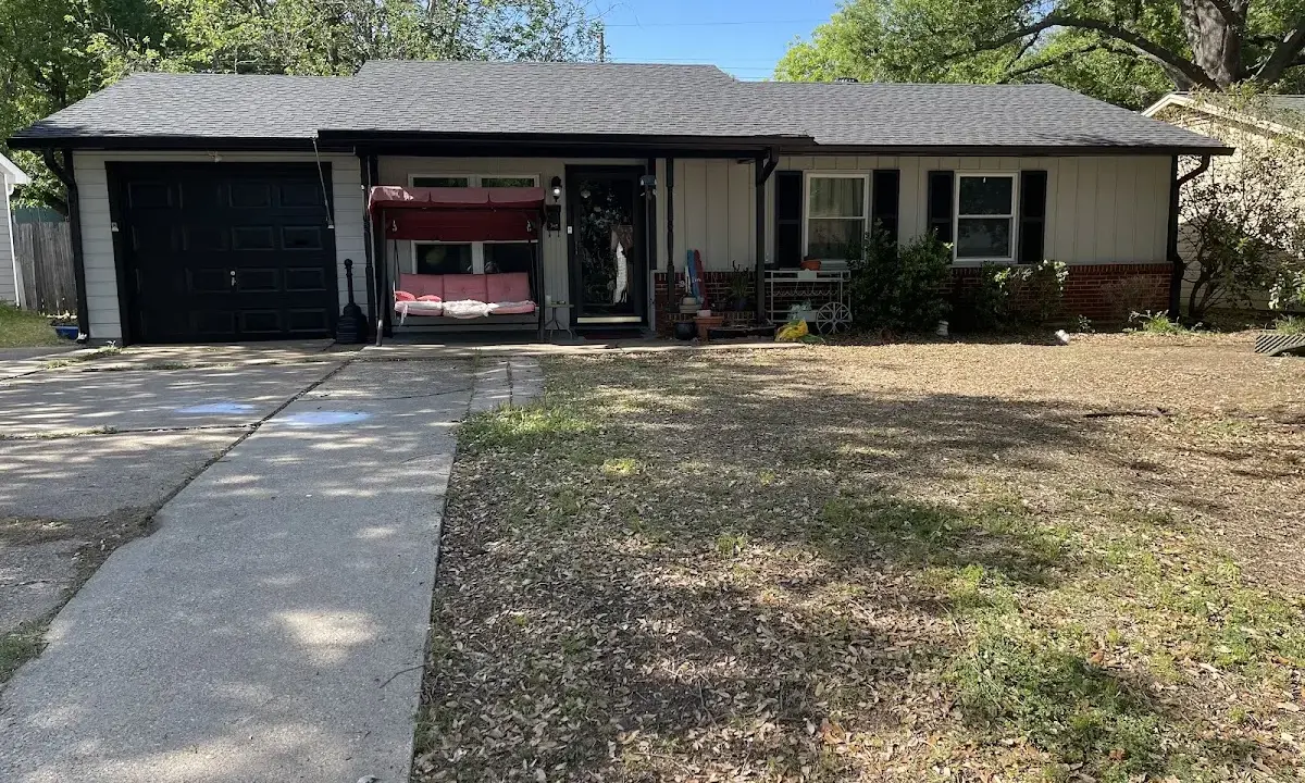 Wind Damage Roof Repair crew at work on a residential roof in DeFuniak Springs